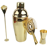 Kit cocktail doré complet posé sur fond blanc : shaker, cuillère à mélange torsadée, passoire à glaçons et doseur