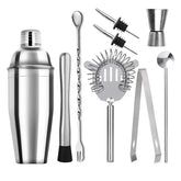 Kit cocktail classique complet avec shaker, doseur, cuillère à mélange, pilon, passoire à glaçons et pince en acier inoxydable, présenté sur fond blanc.
