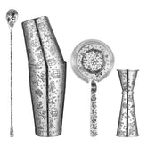Set complet d'accessoires de bar tiki 5 pièces avec gravures pirate et sirène : cuillère, shaker, passoire et doseur en inox.