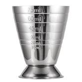 Verre doseur à cocktail en acier inoxydable avec graduations de 15 à 75 ml, photographié sur fond blanc.