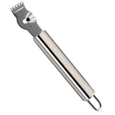 Zesteur à agrumes en inox sur fond blanc, vue produit isolée.
