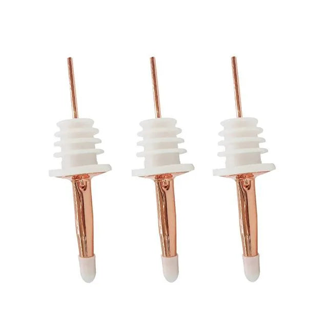 Lot de trois becs verseurs finition or rose pour bouteille d'alcool, photo produit sur fond blanc.