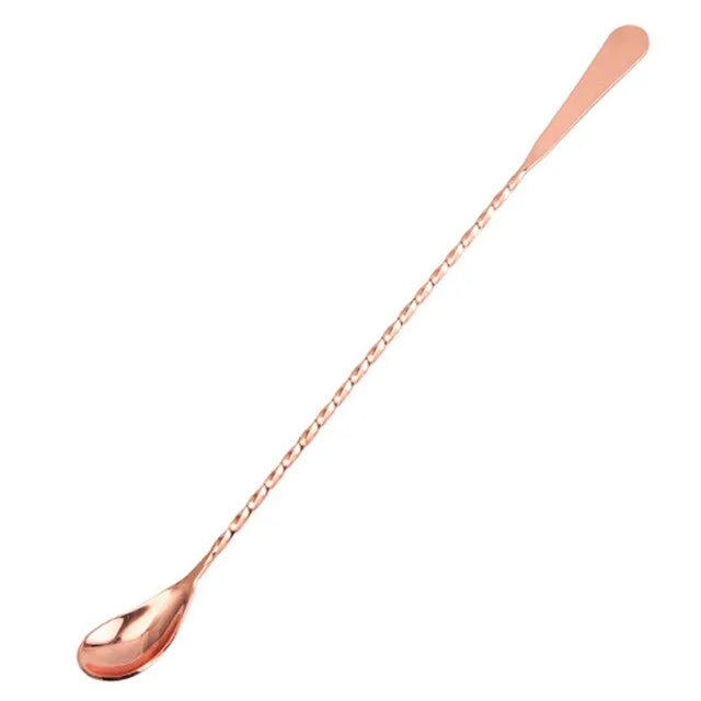 Cuillère à cocktail grande taille en finition bronze, présentée sur fond blanc