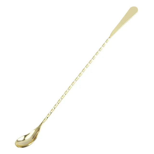 Cuillère à cocktail grande taille en finition dorée, présentée sur fond blanc
