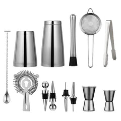 Vue éclatée de tous les accessoires du kit cocktail Boston : shaker, cuillère à mélange, pilon, passoires, jiggers et bouchons verseurs