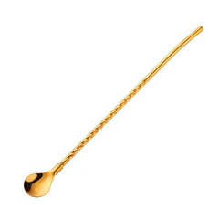 Paille cuillère dorée sur fond blanc avec tige torsadée et cuillère ovale