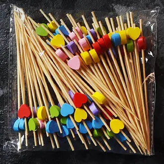 Sachet de piques à cocktail en bambou avec cœurs multicolores rouge, jaune, bleu et rose