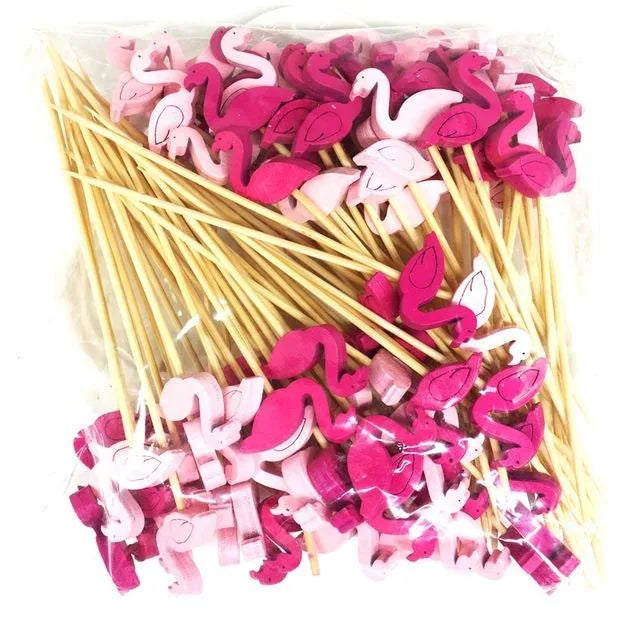 Sachet transparent rempli d'une centaine de piques apéritif en bois surmontés de petits flamants roses, roses et fuchsias.