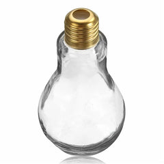 Verre à cocktail ampoule vide et transparent, debout, vue de face avec son bouchon doré vissé.