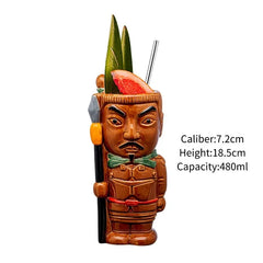 Photo produit sur fond blanc du verre Tiki Suavecita à nœud papillon vert, 7,2 cm de diamètre, 18,5 cm de hauteur, contenance 480 ml.